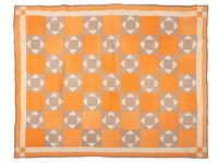 An Orange and Floral Fabric Box Pieced Cotton Quilt