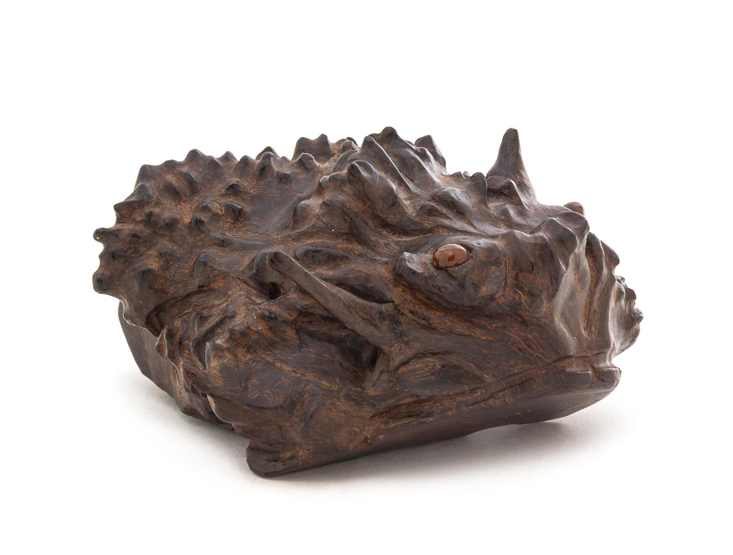 A Carved Burlwood Creature Length 6 3/4 inches.