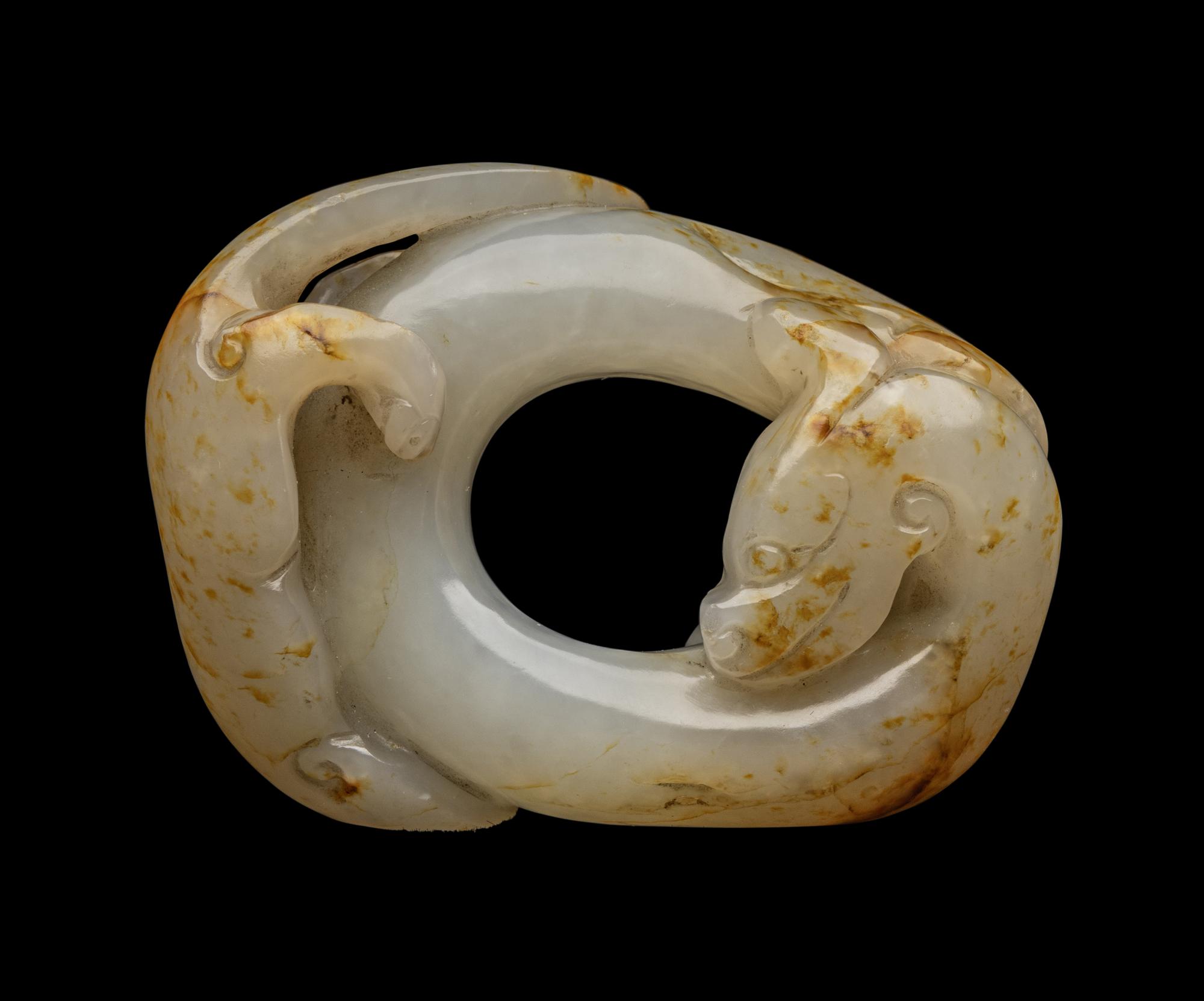 A Chinese Russet and White Jade 'Chilong' Bi- Form Pendant