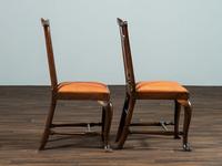 A Set of Six Queen Anne Pierce Carved Mahogany Stretcher Base and Trifid Foot Side Chairs