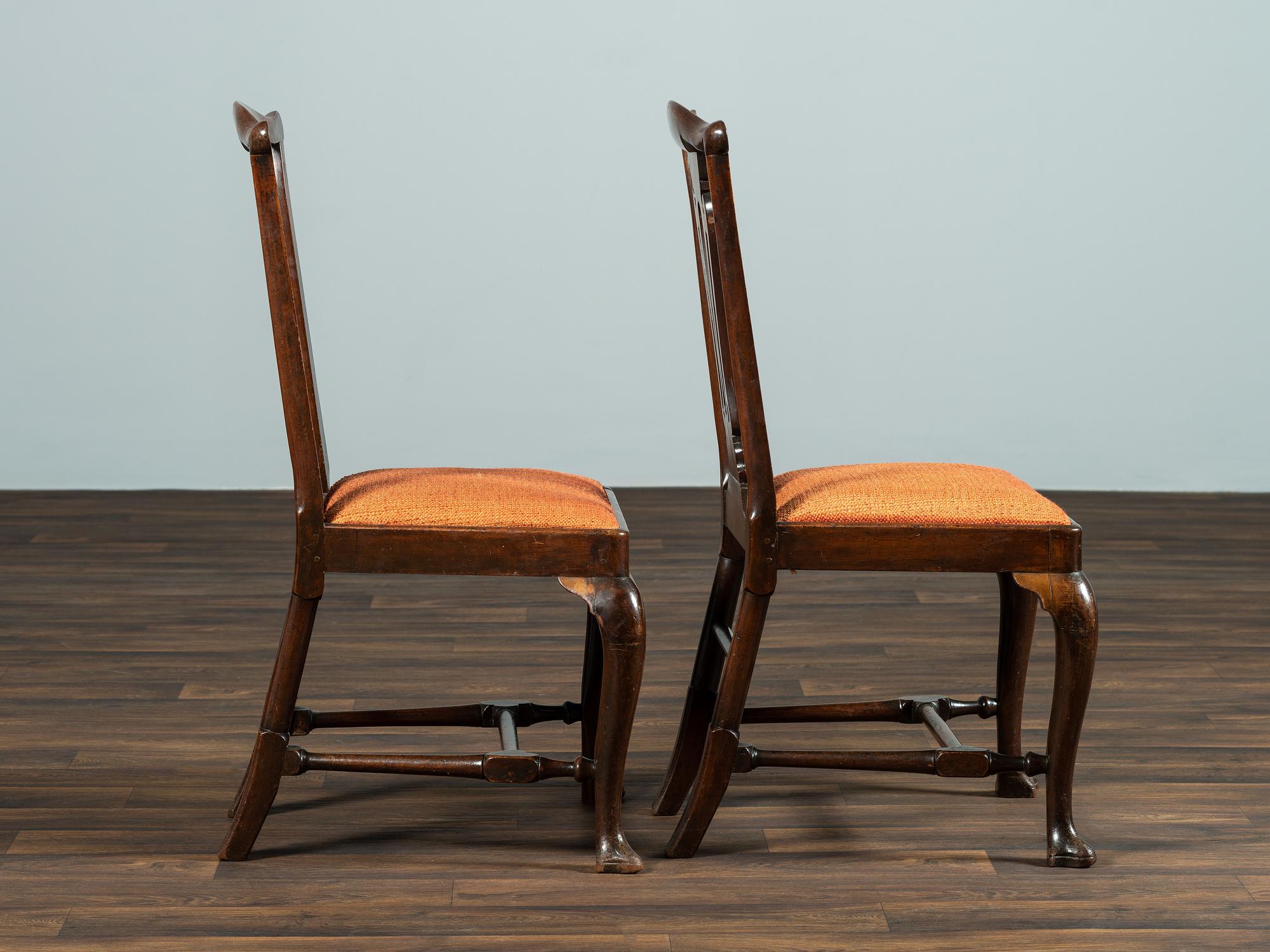 A Set of Six Queen Anne Pierce Carved Mahogany Stretcher Base and Trifid Foot Side Chairs