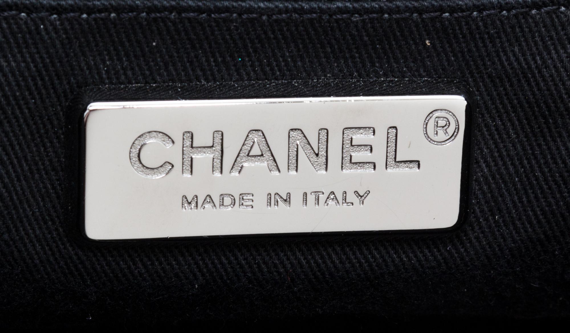 A Chanel Black Pony Hair Drawstring Tote Bag, 14" x 9" x 5".