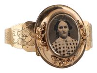 [EARLY PHOTOGRAPHY]. Daguerreian "sweetheart" 10K gold cuff containing portrait of young woman.