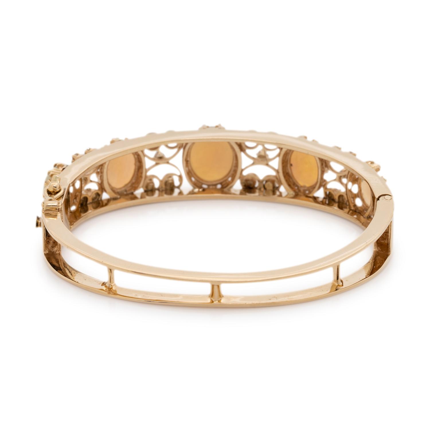 YELLOW GOLD, OPAL AND DIAMOND BANGLE BRACELET