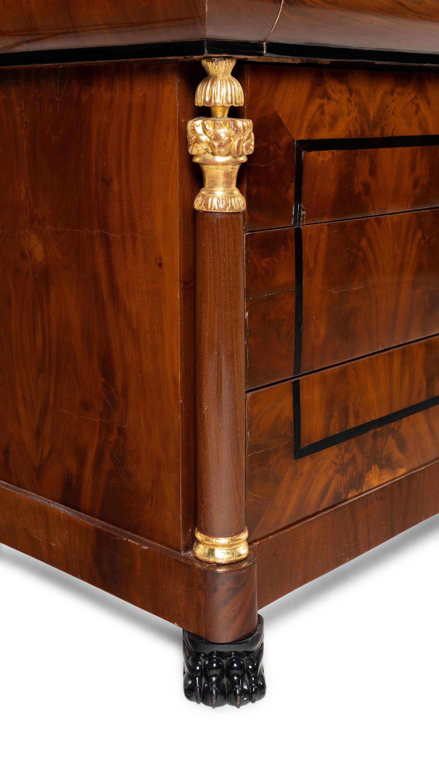 A Pair of German Neoclassical Mahogany and Parcel-Gilt Commodes