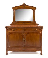 Louis Majorelle, (French, 1859-1926), a bedroom set, comprising an armoire separated into two individual display cabinets, two twin hea
