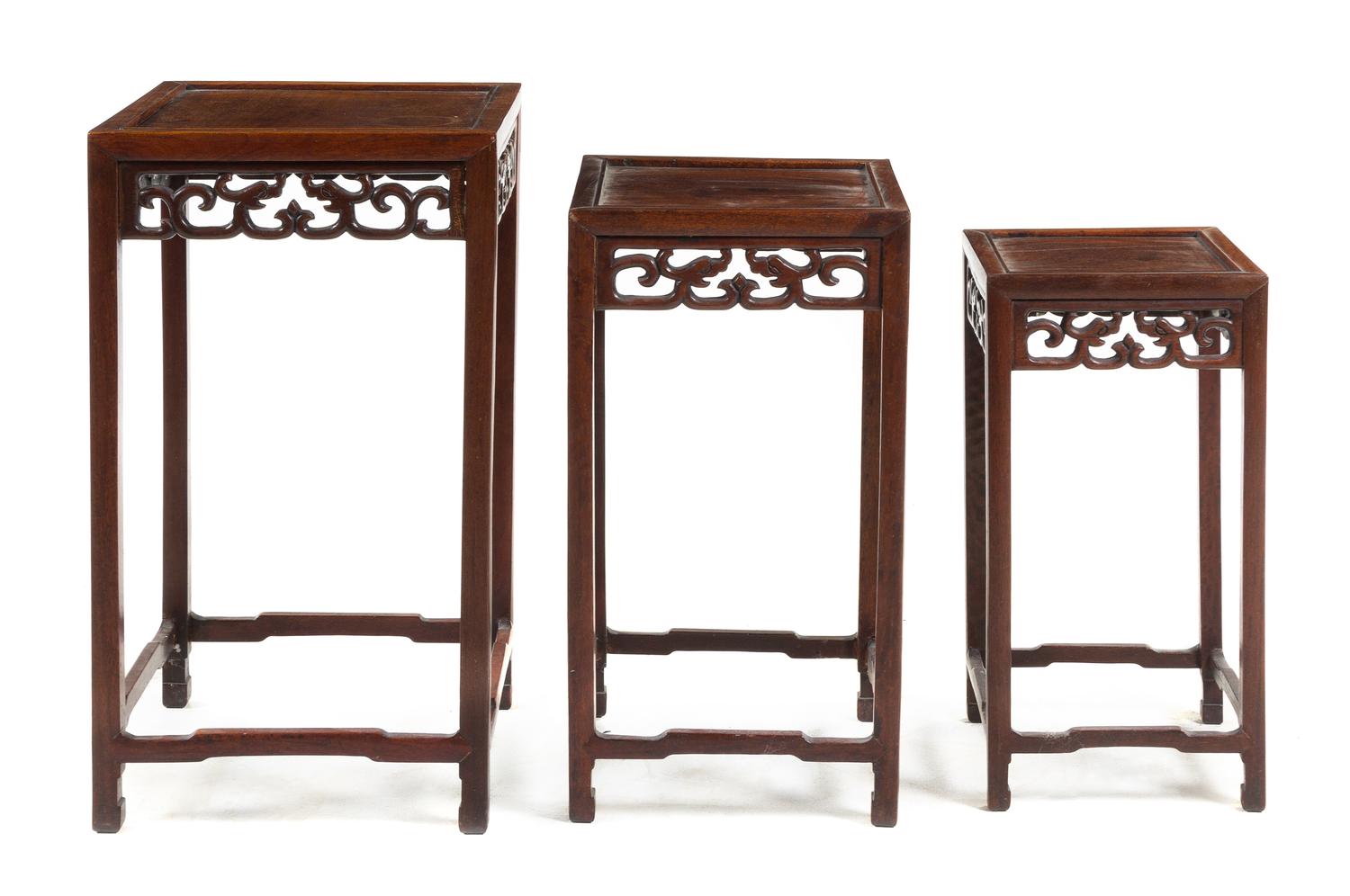 A Set of Three Chinese Hardwood Nesting Tables Height of tallest 26 x width 15 x depth 15 inches. — 20TH CENTURY