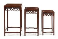A Set of Three Chinese Hardwood Nesting Tables Height of tallest 26 x width 15 x depth 15 inches. — 20TH CENTURY