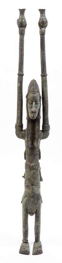 An African Cast Metal Maternity Figure Height 27 1/8 inches.