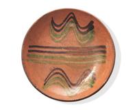 A Green and Brown Slip-Decorated Redware Pie Plate, Dryville, Pennsylvania, 19th Century