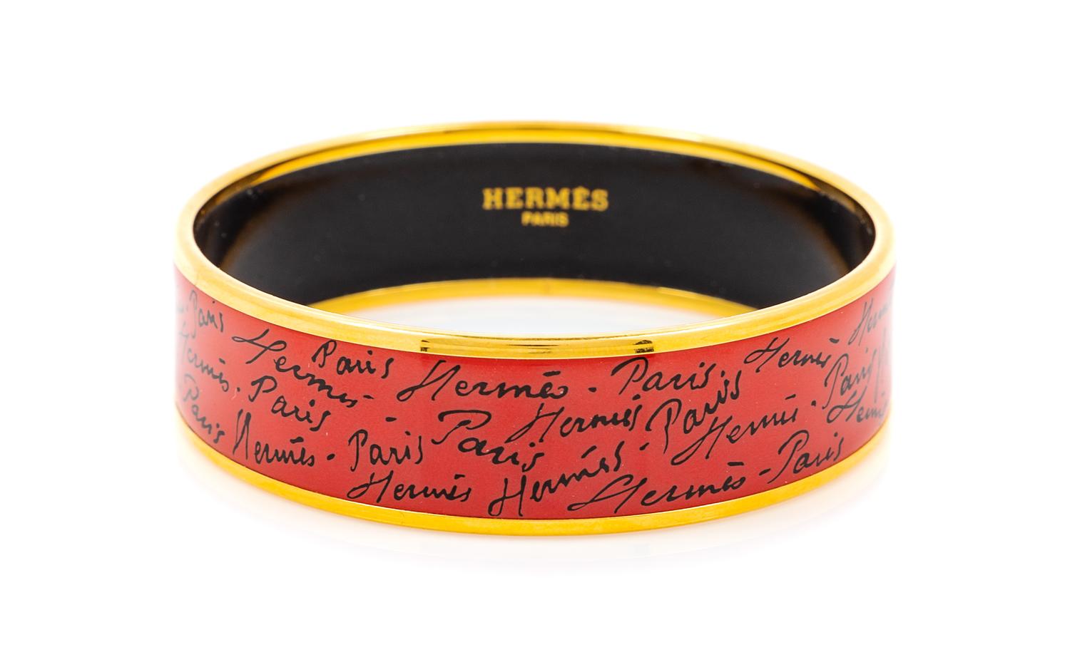 An Hermès Red/Orange Enamel 65mm Bangle, 6.5cm diameter, .75" W.