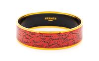 An Hermès Red/Orange Enamel 65mm Bangle, 6.5cm diameter, .75" W.