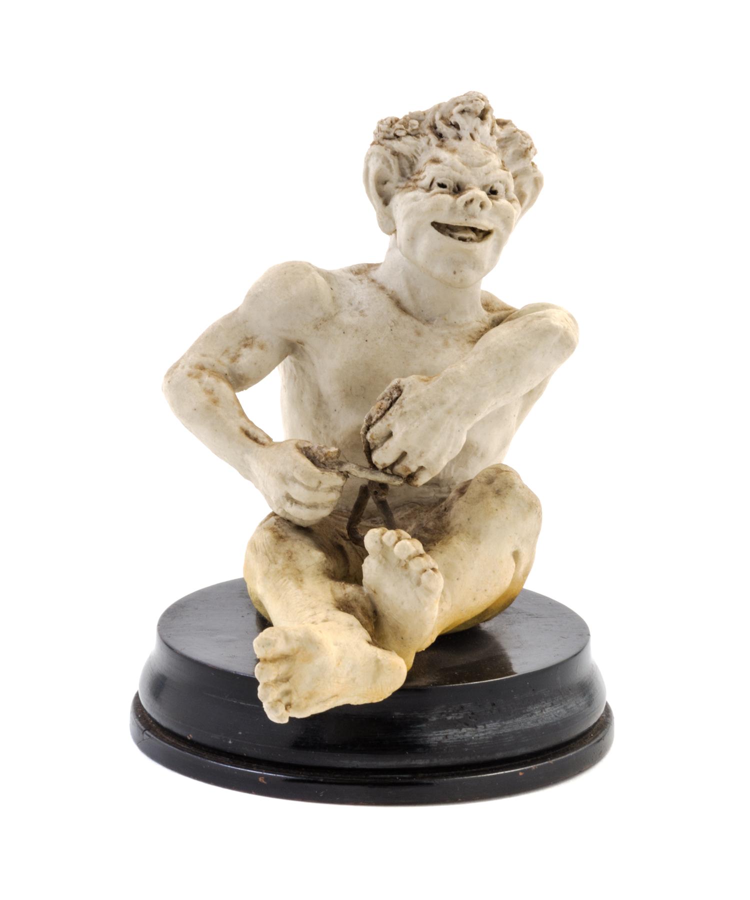 A Martin Brothers Stoneware Figure Height overall 5 1/4 inches. — LATE 19TH CENTURY