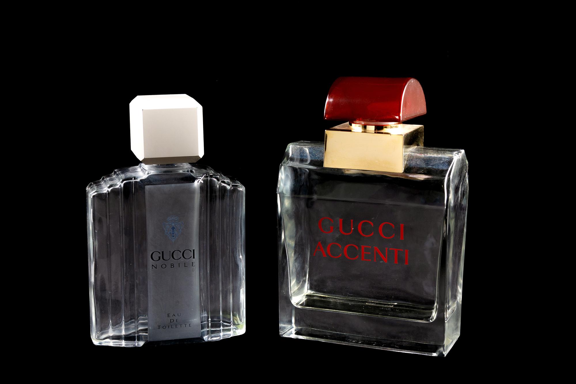 A Group of Two Gucci Factice Perfume Bottles