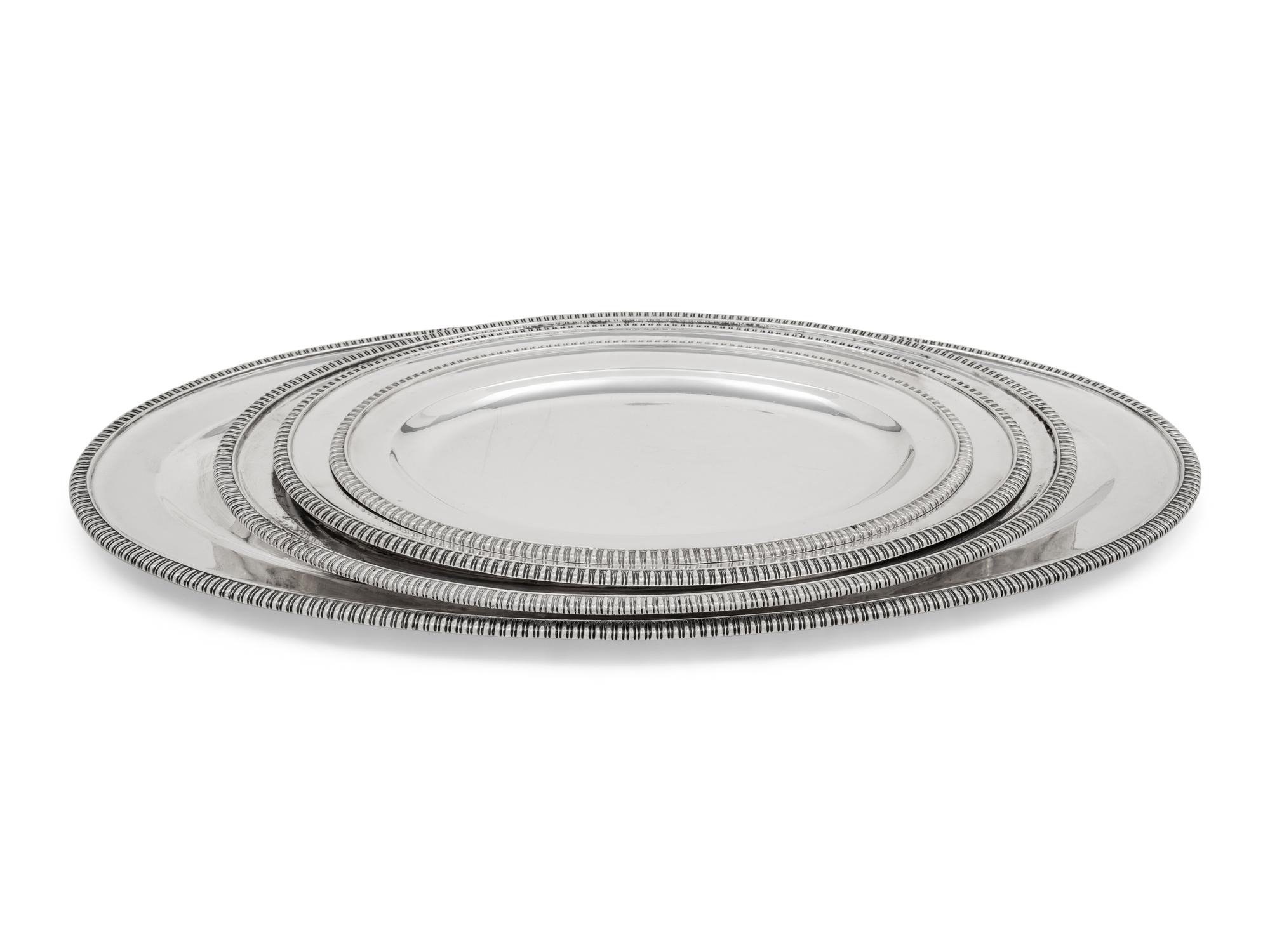 A Group of Four English Silver Serving Trays