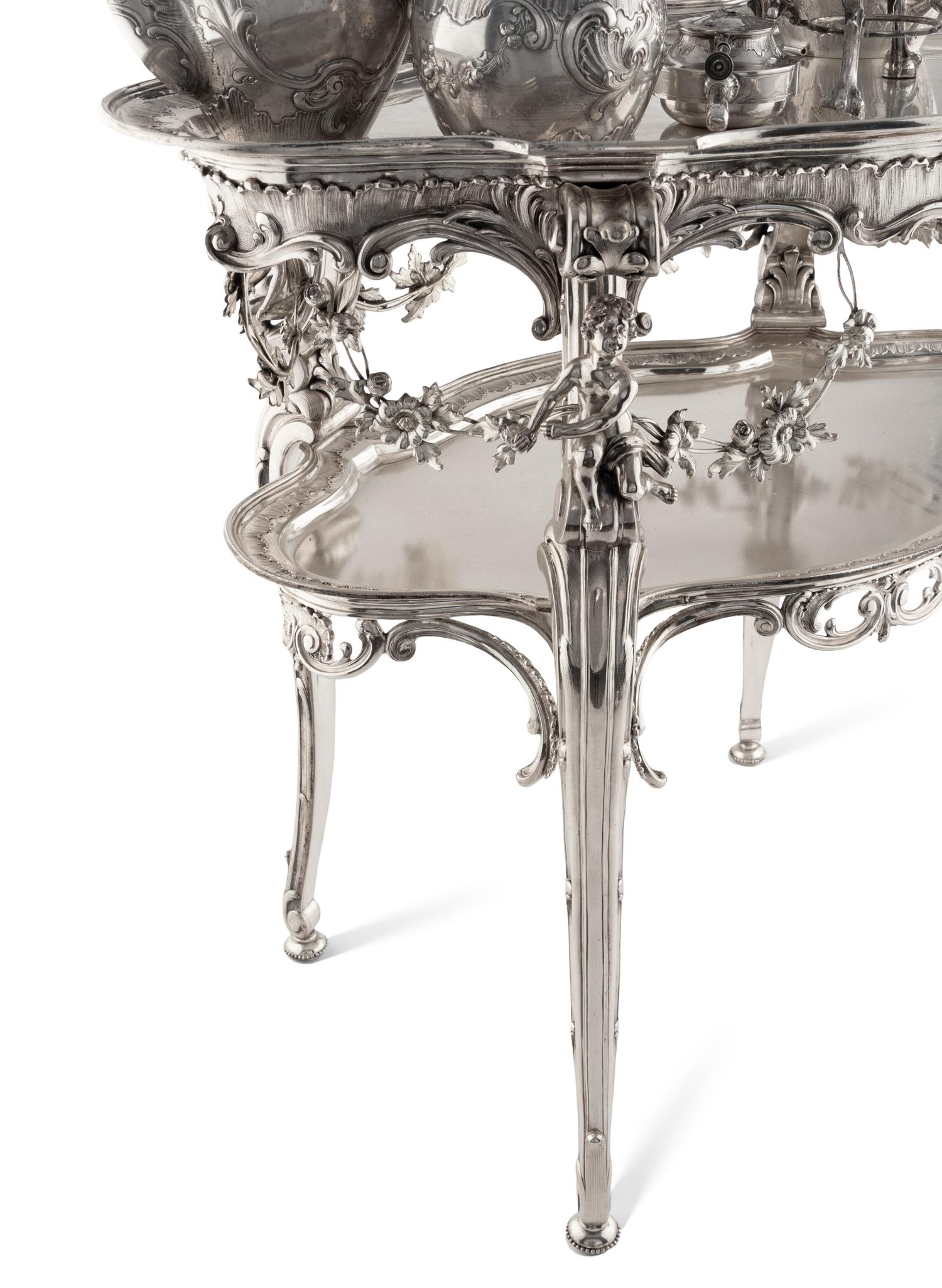 A Rare German Silver Two-Tier Tea Table with Matching Five-Piece Tea Service and Two Trays