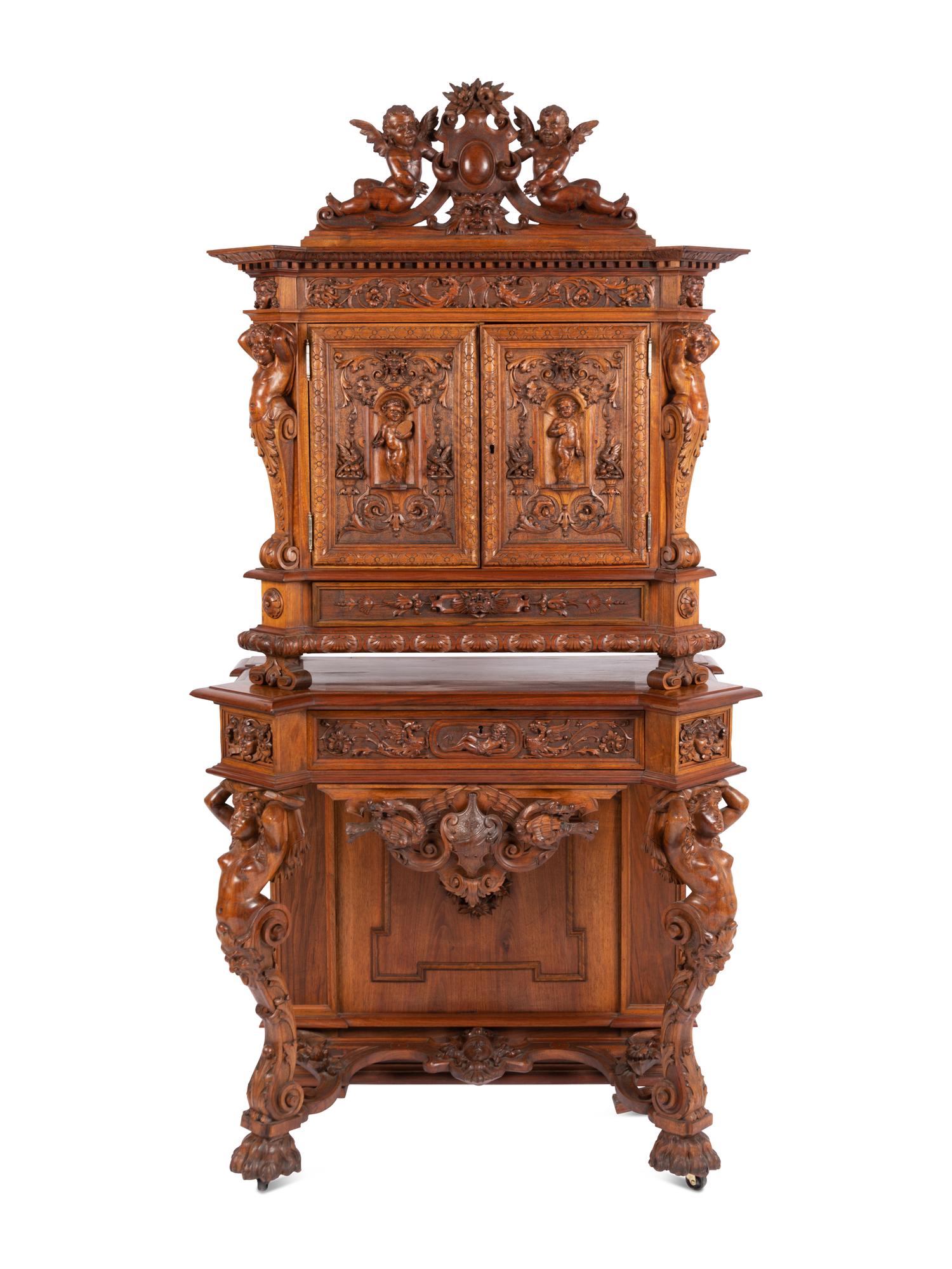 A Renaissance Revival Carved Walnut Cabinet In the Manner of Alexander Roux