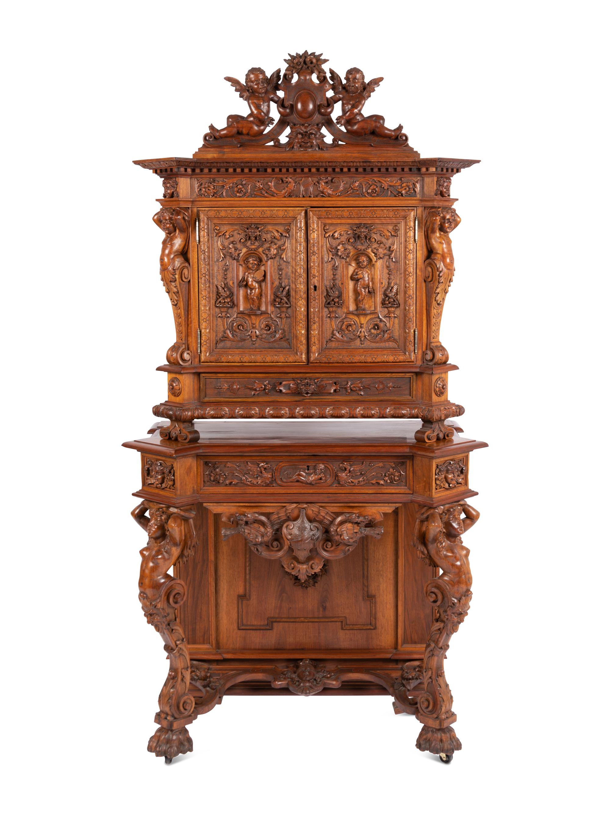 A Renaissance Revival Carved Walnut Cabinet In the Manner of Alexander Roux