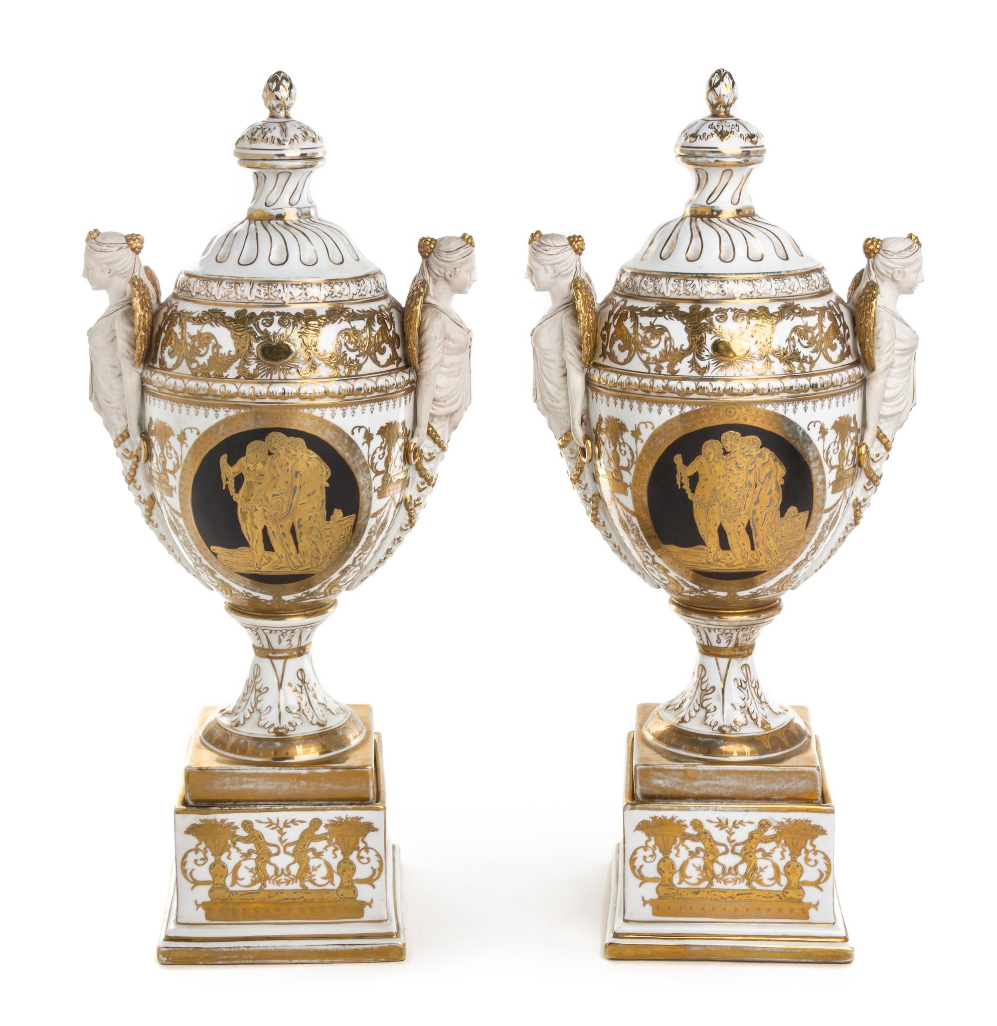 A Pair of Berlin (K.P.M.) Porcelain Covered Urns on Stands Height 22 1/2 inches. — 19TH CENTURY
