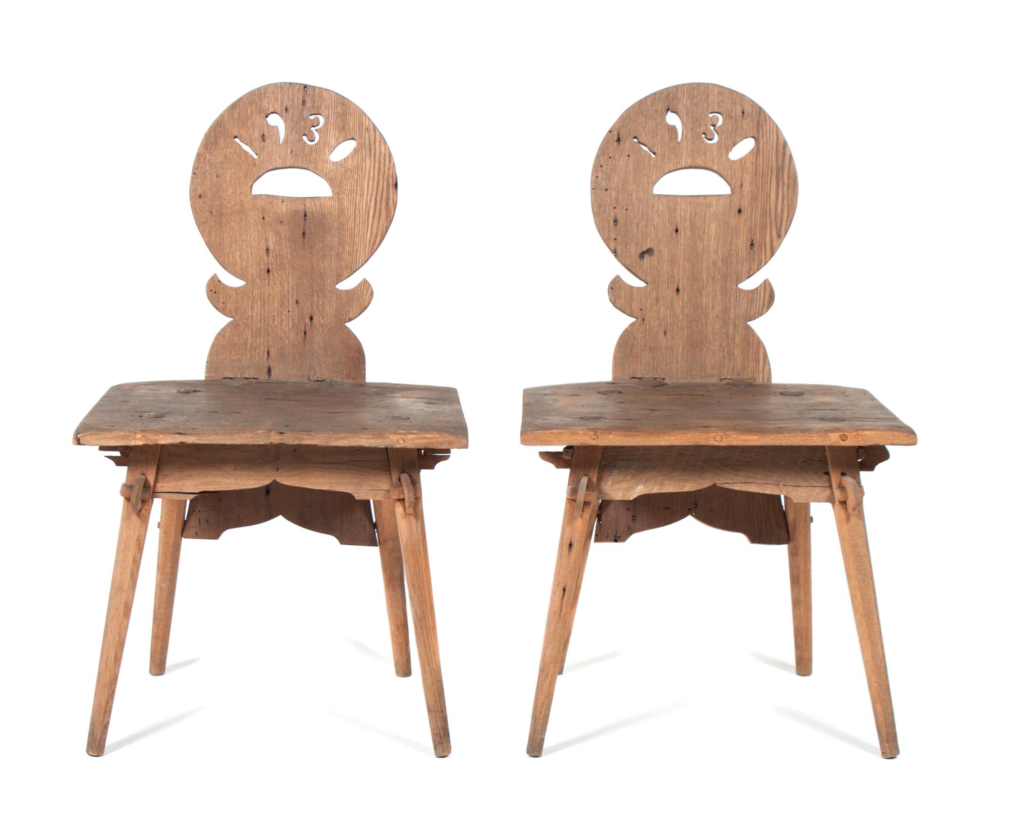 A Pair of Hand Carved Folk Art Chairs Height of each 33 inches. — 1930