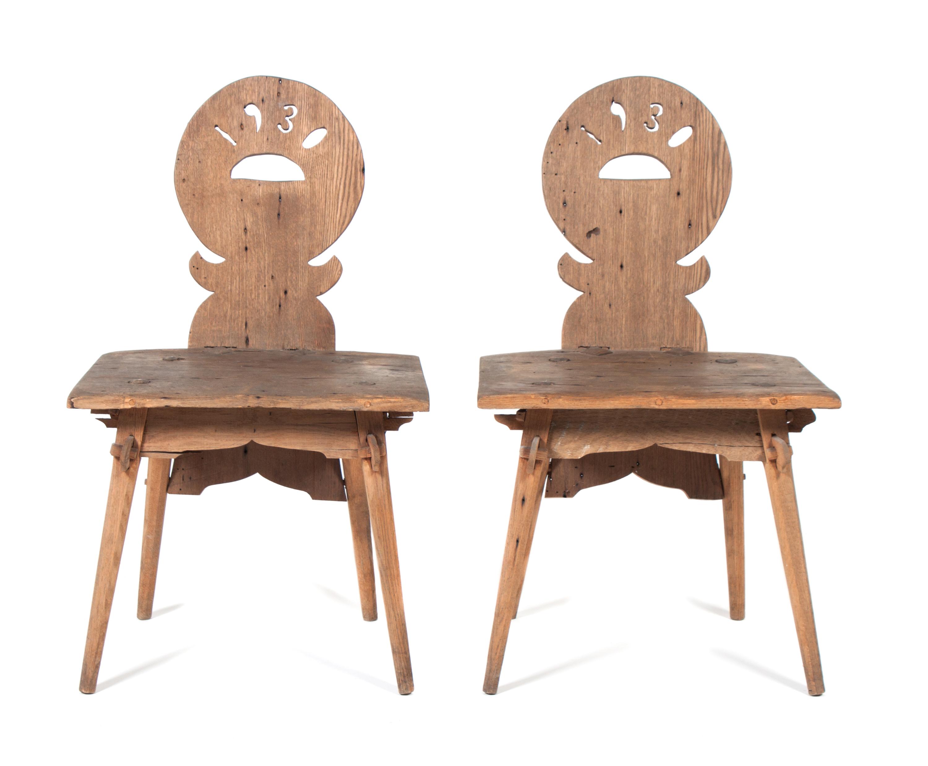 A Pair of Hand Carved Folk Art Chairs Height of each 33 inches. — 1930