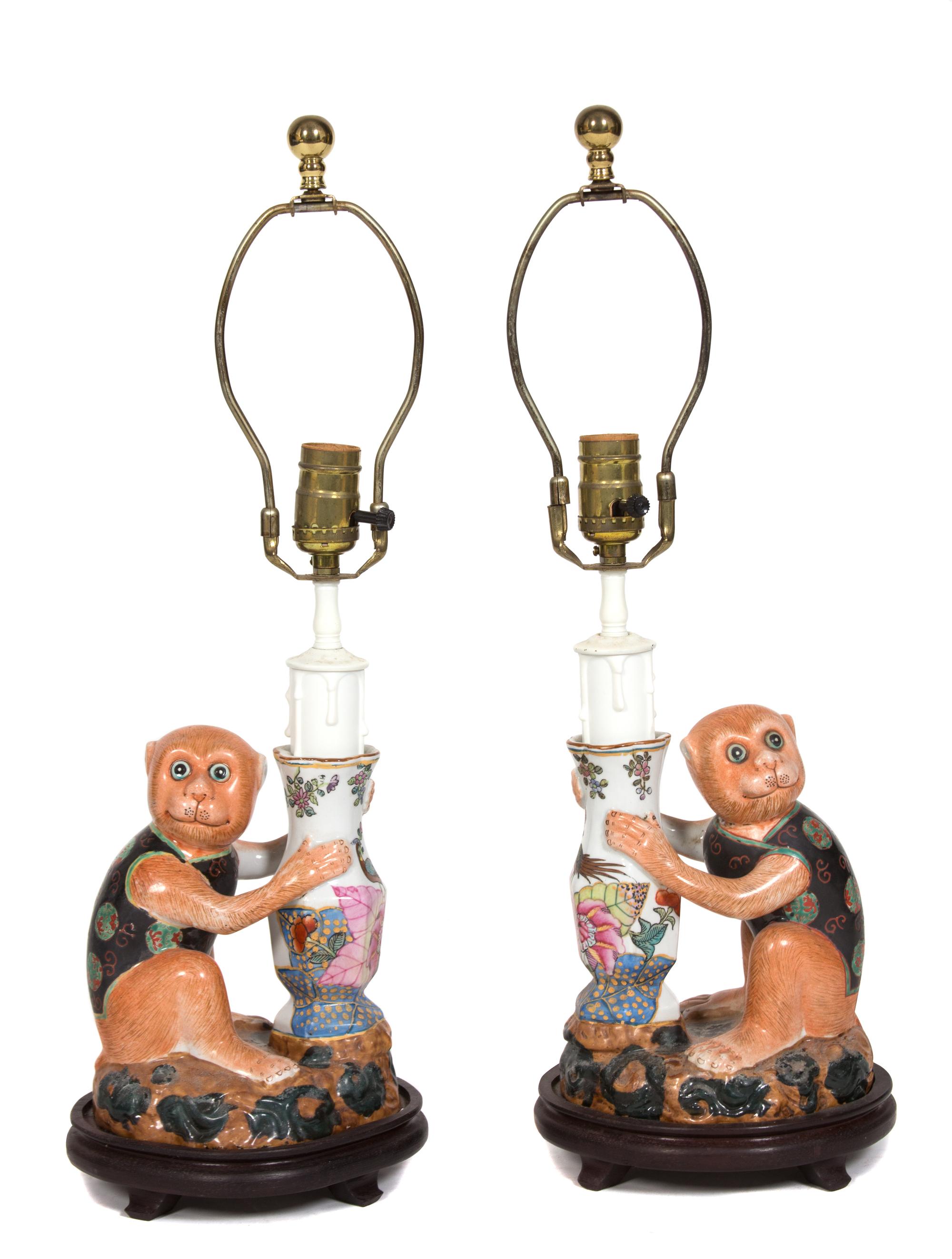 A Pair of Polychromed Ceramic Monkey Lamps Overall height 23 inches. — 20TH CENTURY