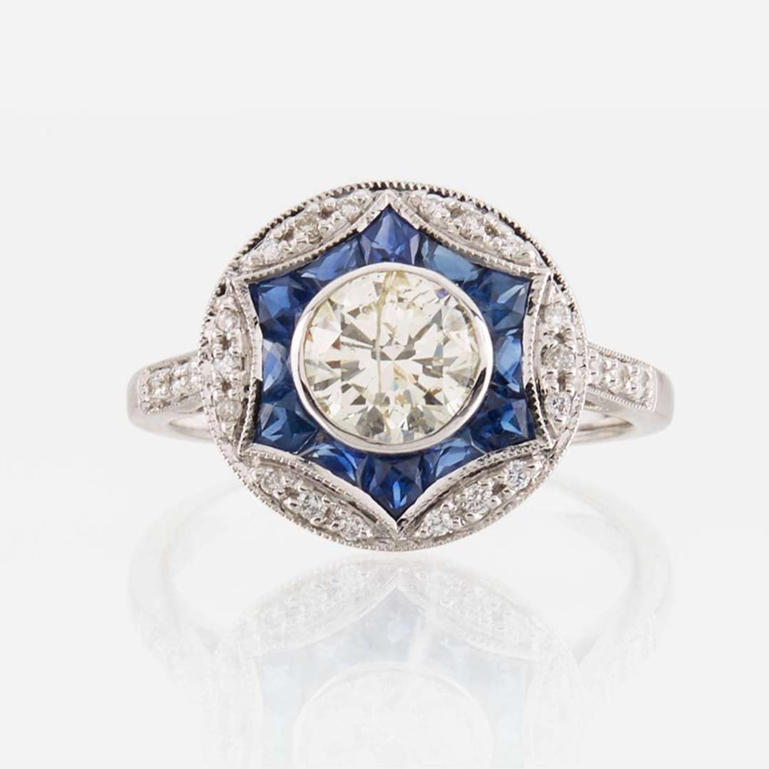 A diamond, sapphire, and white gold ring