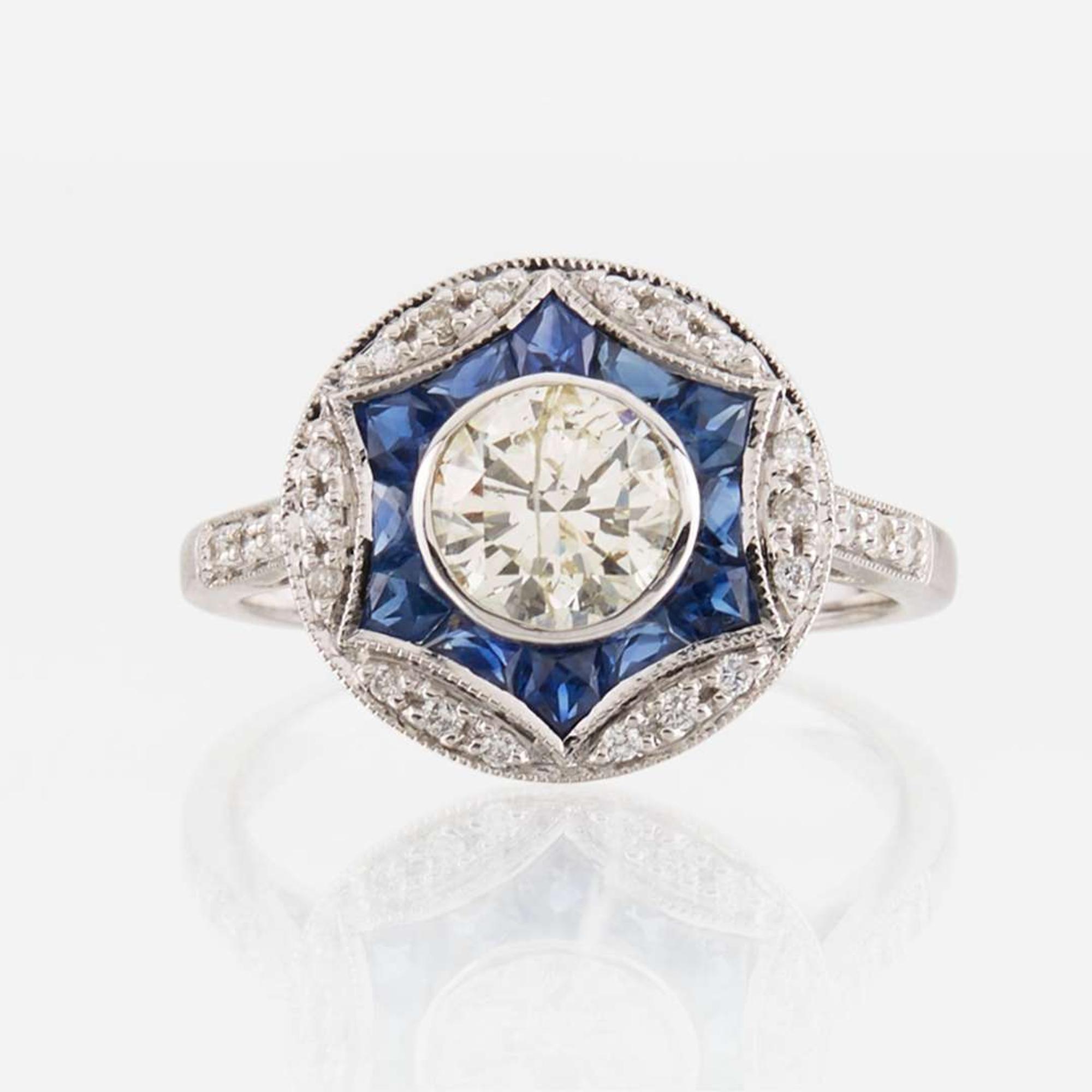 A diamond, sapphire, and white gold ring