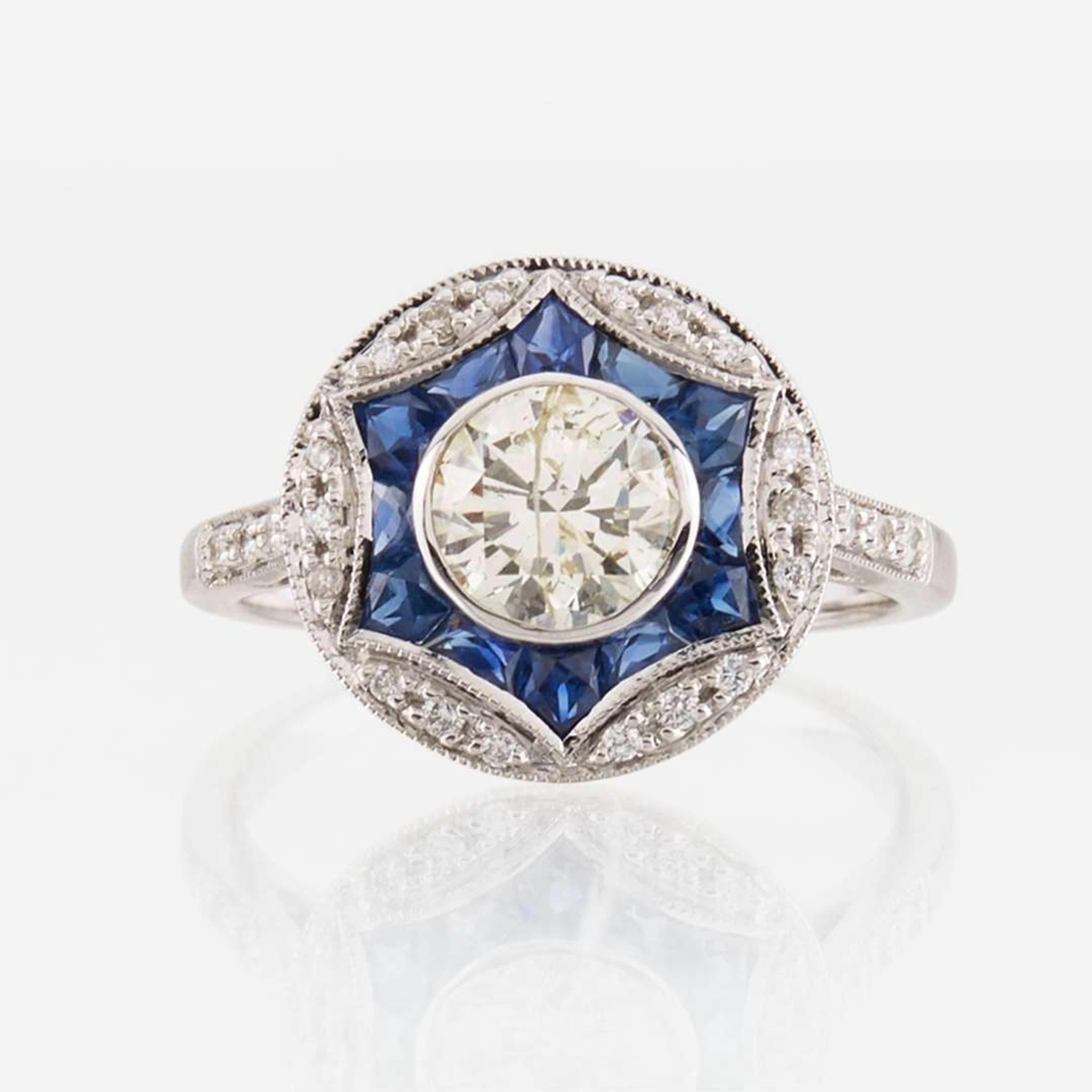 A diamond, sapphire, and white gold ring
