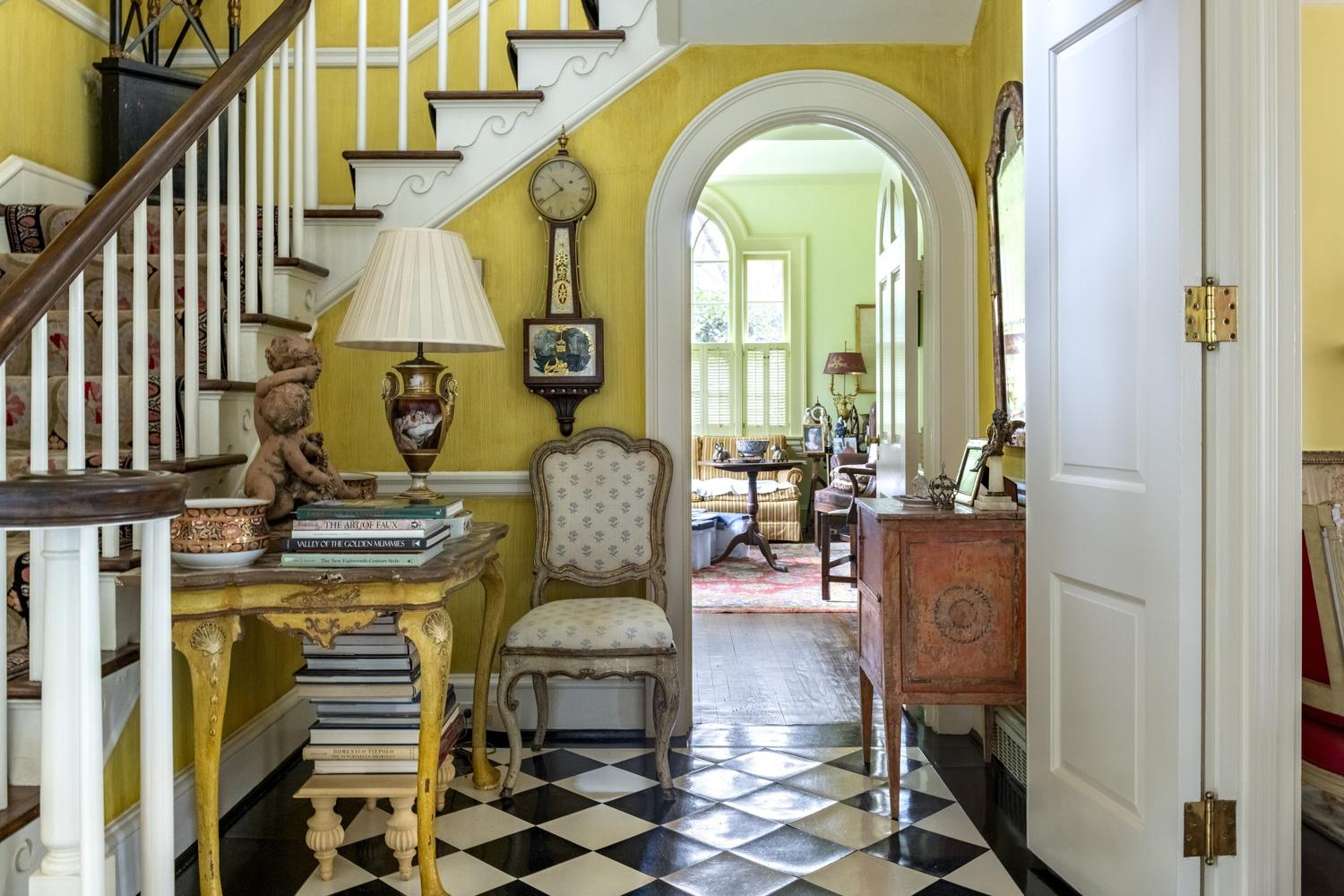A Pair of Régence Walnut Open Armchairs