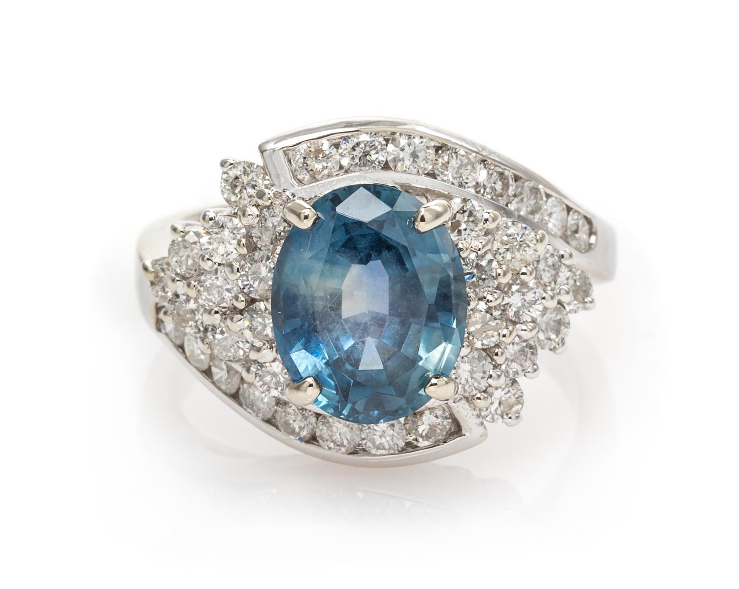 A 14 Karat White Gold, Sapphire and Diamond Ring, 4.40 dwts.