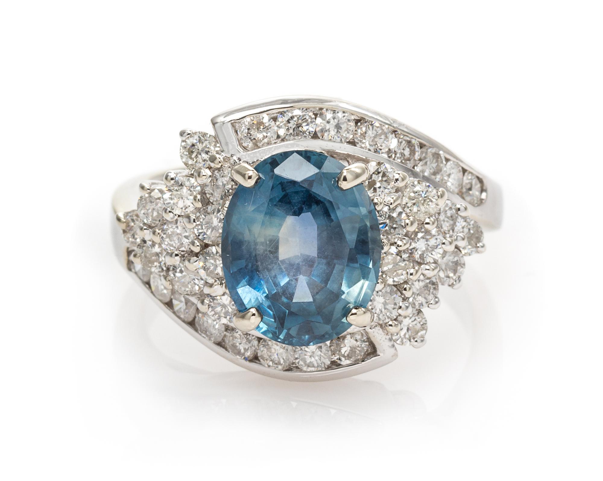 A 14 Karat White Gold, Sapphire and Diamond Ring, 4.40 dwts.