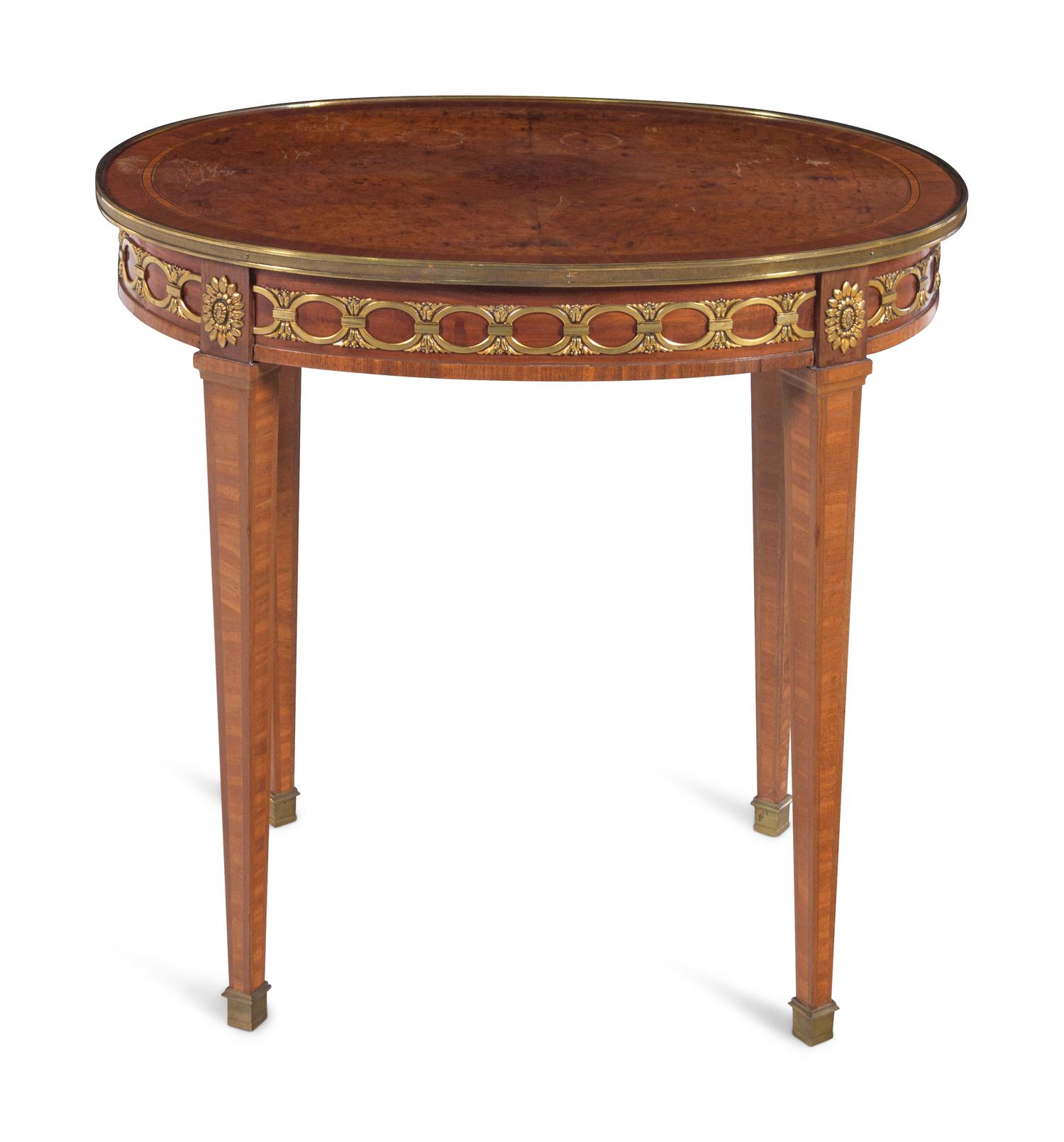 A Louis XVI Style Gilt Bronze Mounted Mahogany and Amboyna Guéridon