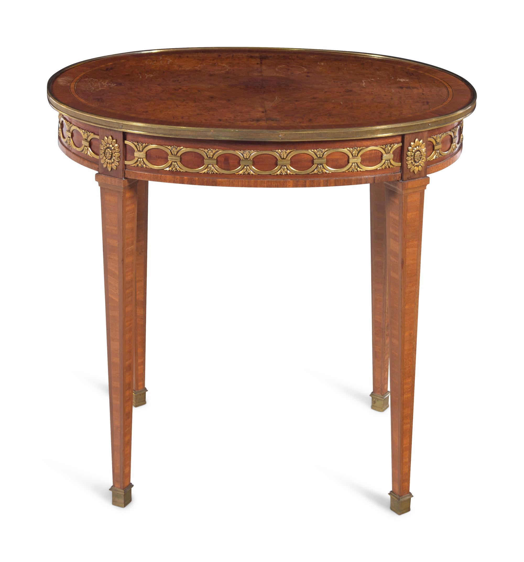 A Louis XVI Style Gilt Bronze Mounted Mahogany and Amboyna Guéridon