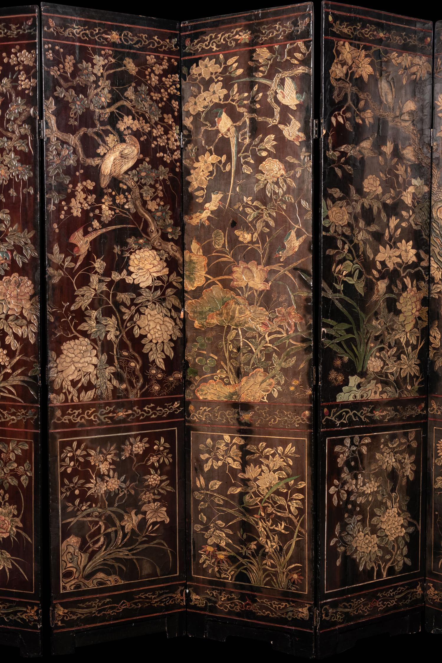 A Coromandel Lacquer Eight-Panel Floor Screen
