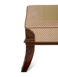 An Egyptian Revival Carved Mahogany Ottoman with Upholstered Seat — 20th Century