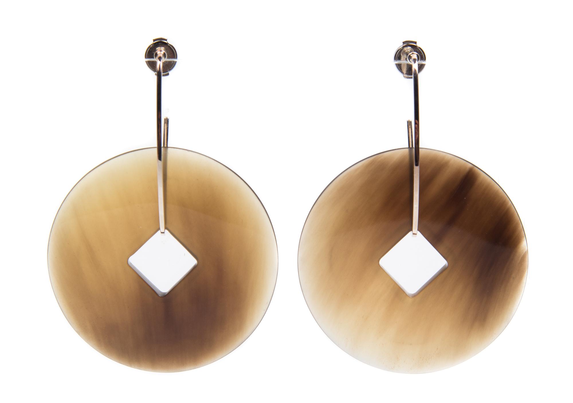 A Pair of Hermes Tsuba Horn and Silver Earrings, 2" x 3".