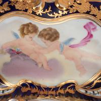 A Pair of Sèvres Style Porcelain Potpourri Vases and Covers