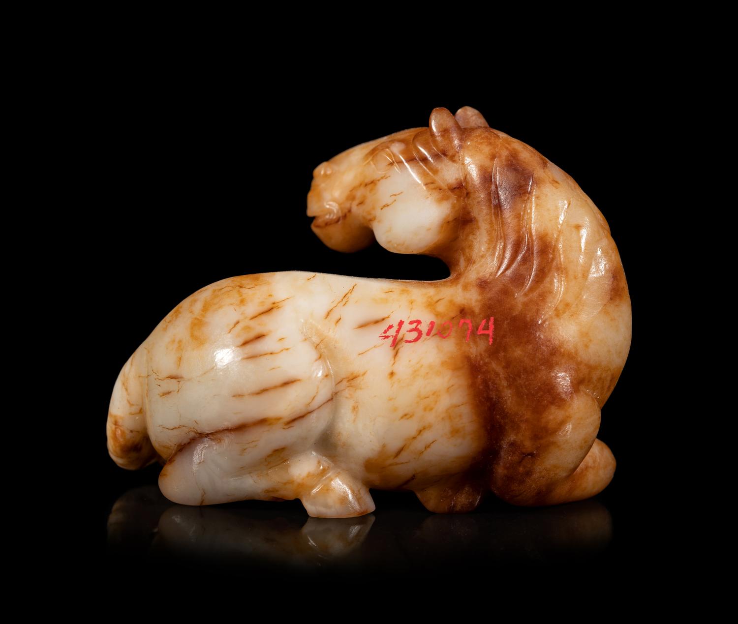 A Yellow Jade Figure of Recumbent Horse