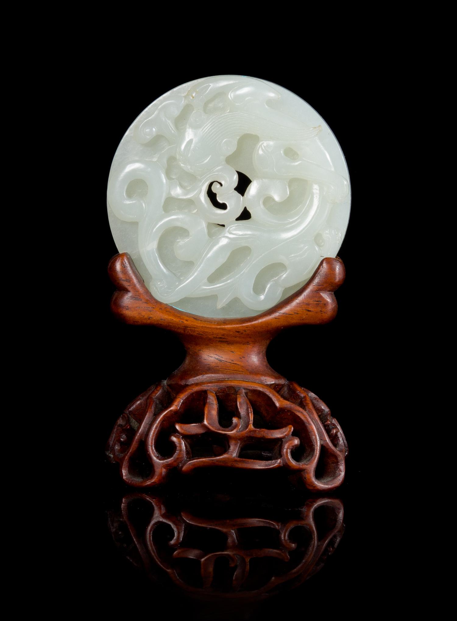 A White Jade 'Dragon' Bi Disc Diameter 2 1/4 inches. — 18TH/19TH CENTURY
