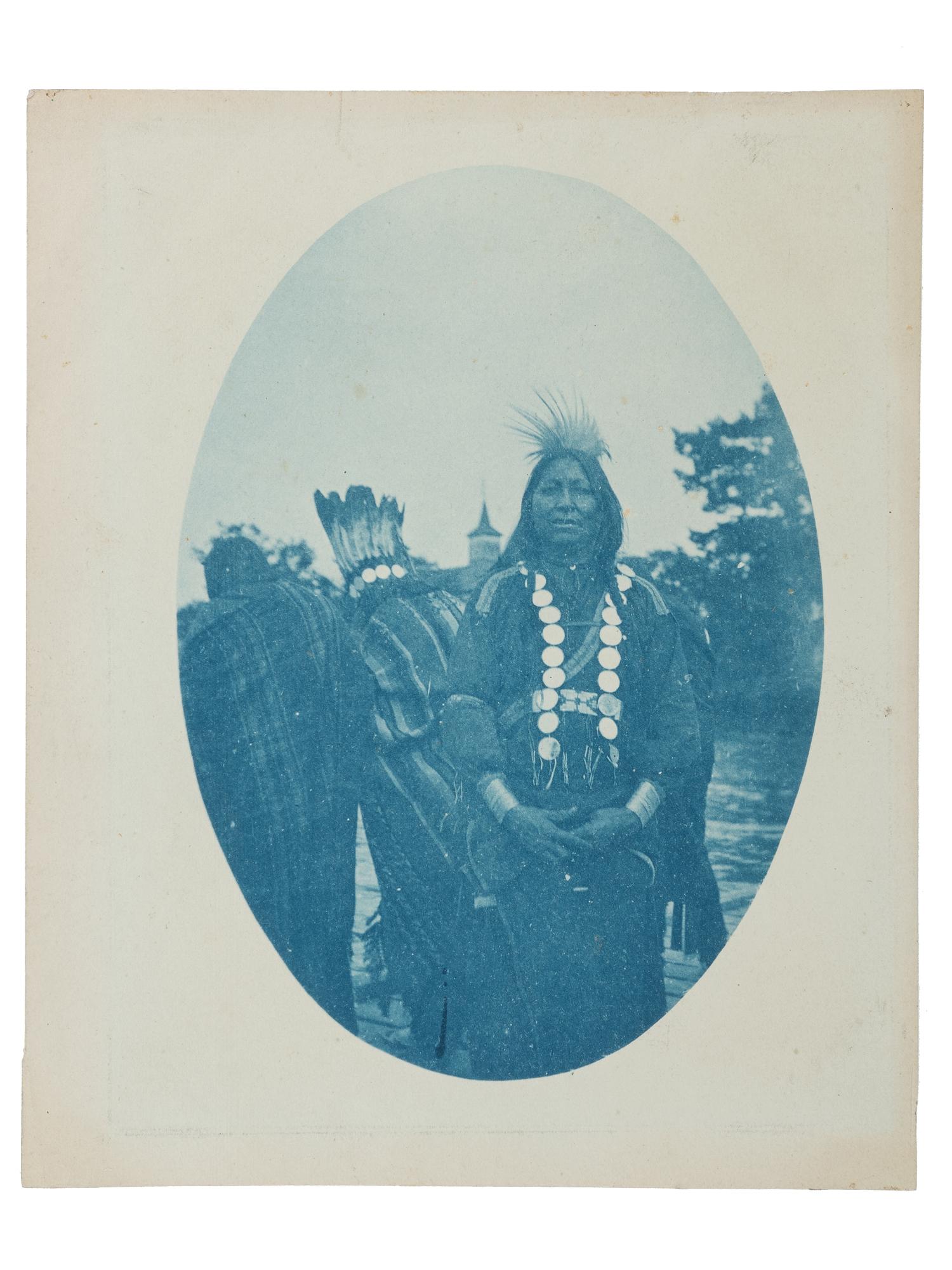 [NATIVE AMERICANS]. A group of 2 photographs of Native American subjects, incl. cyanotype and photograph of subjects in front of blanket.