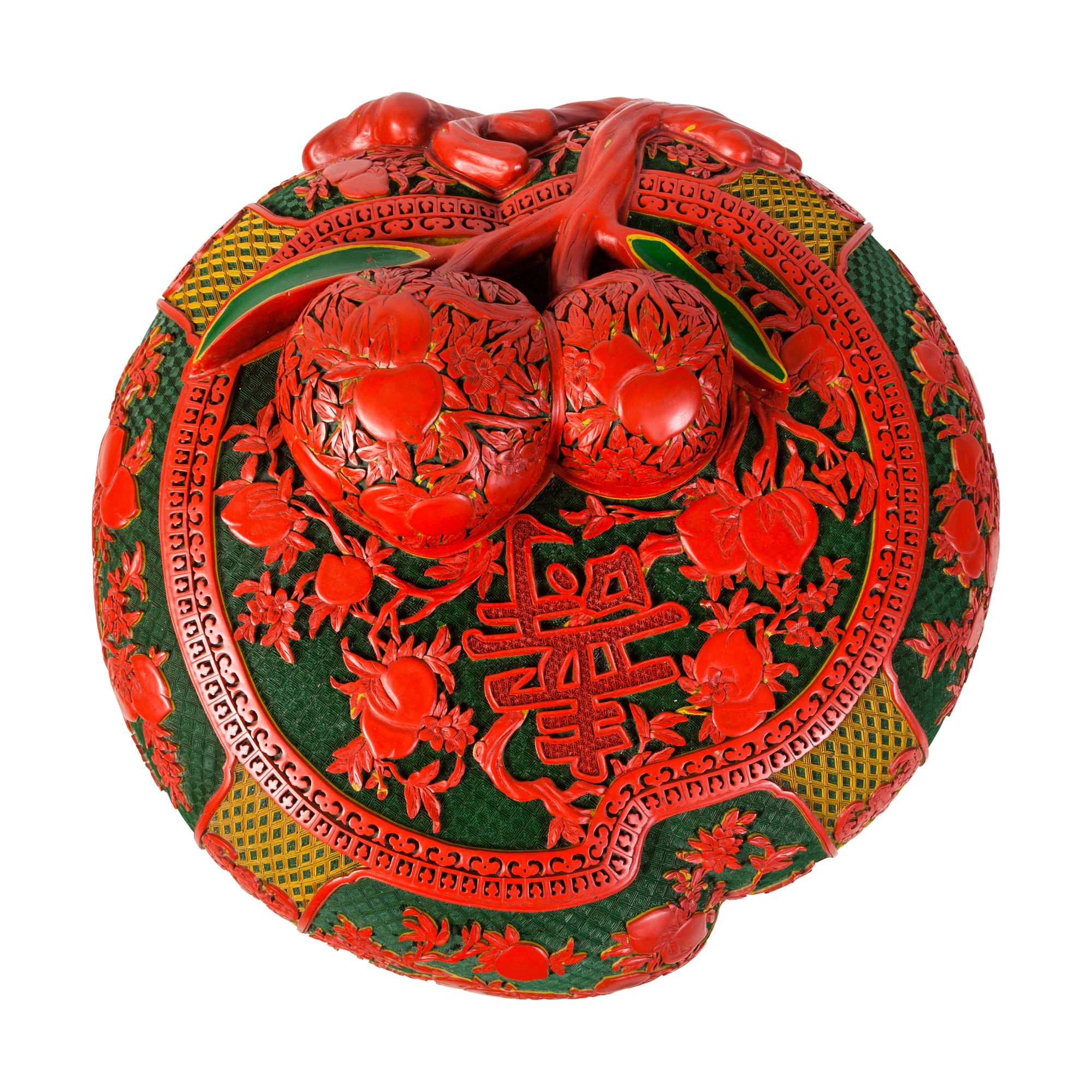A Set of Chinese Export Carved Red Lacquer "Peach" Nesting Boxes and a Stand