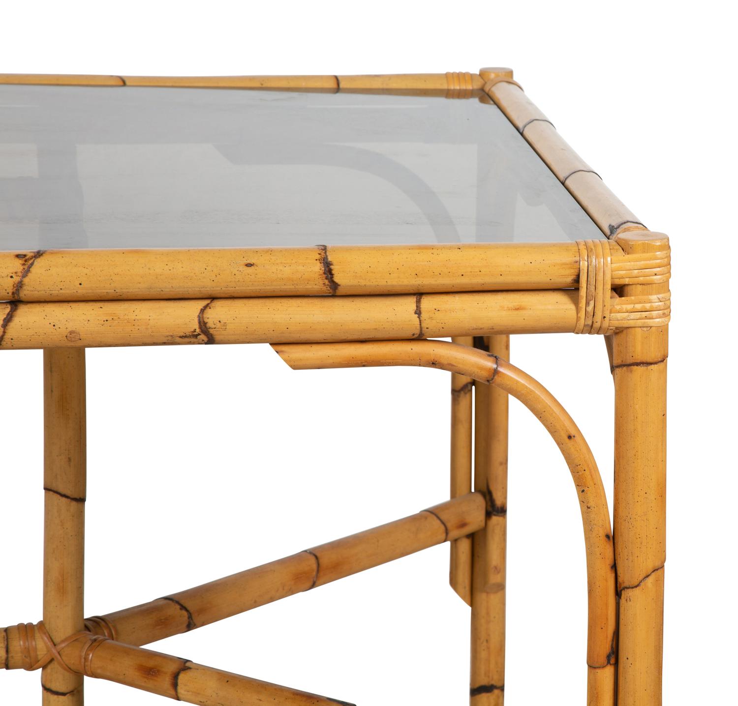 A Bamboo and Rattan Dining Set comprising a table and six chairs.