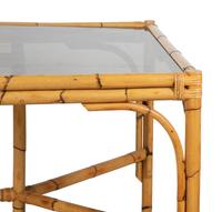 A Bamboo and Rattan Dining Set comprising a table and six chairs.