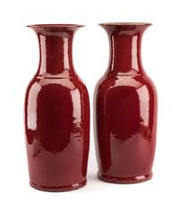 A Pair of Chinese Sang de Boeuf Porcelain Vases Height 21 1/2 inches.