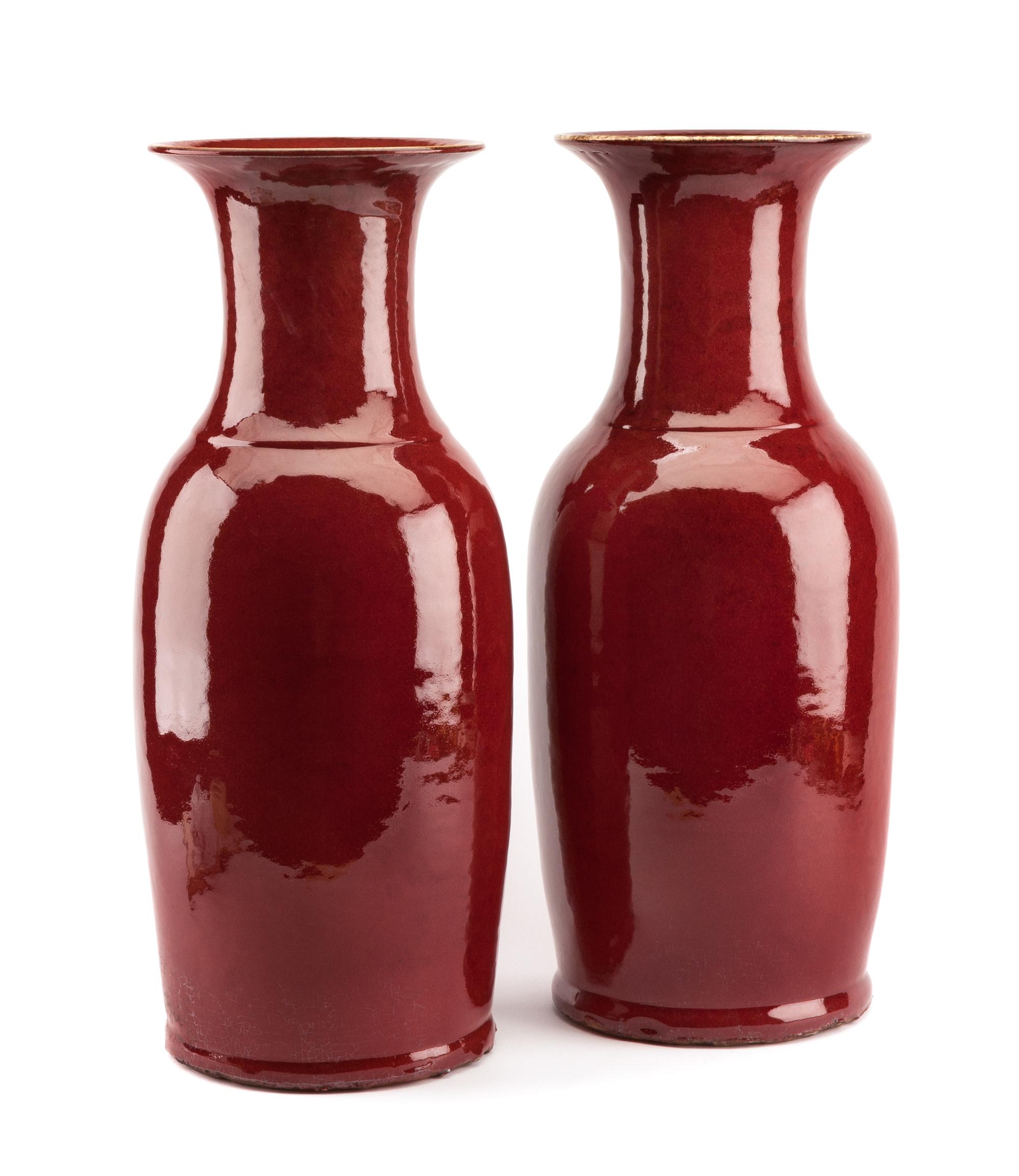 A Pair of Chinese Sang de Boeuf Porcelain Vases Height 21 1/2 inches.