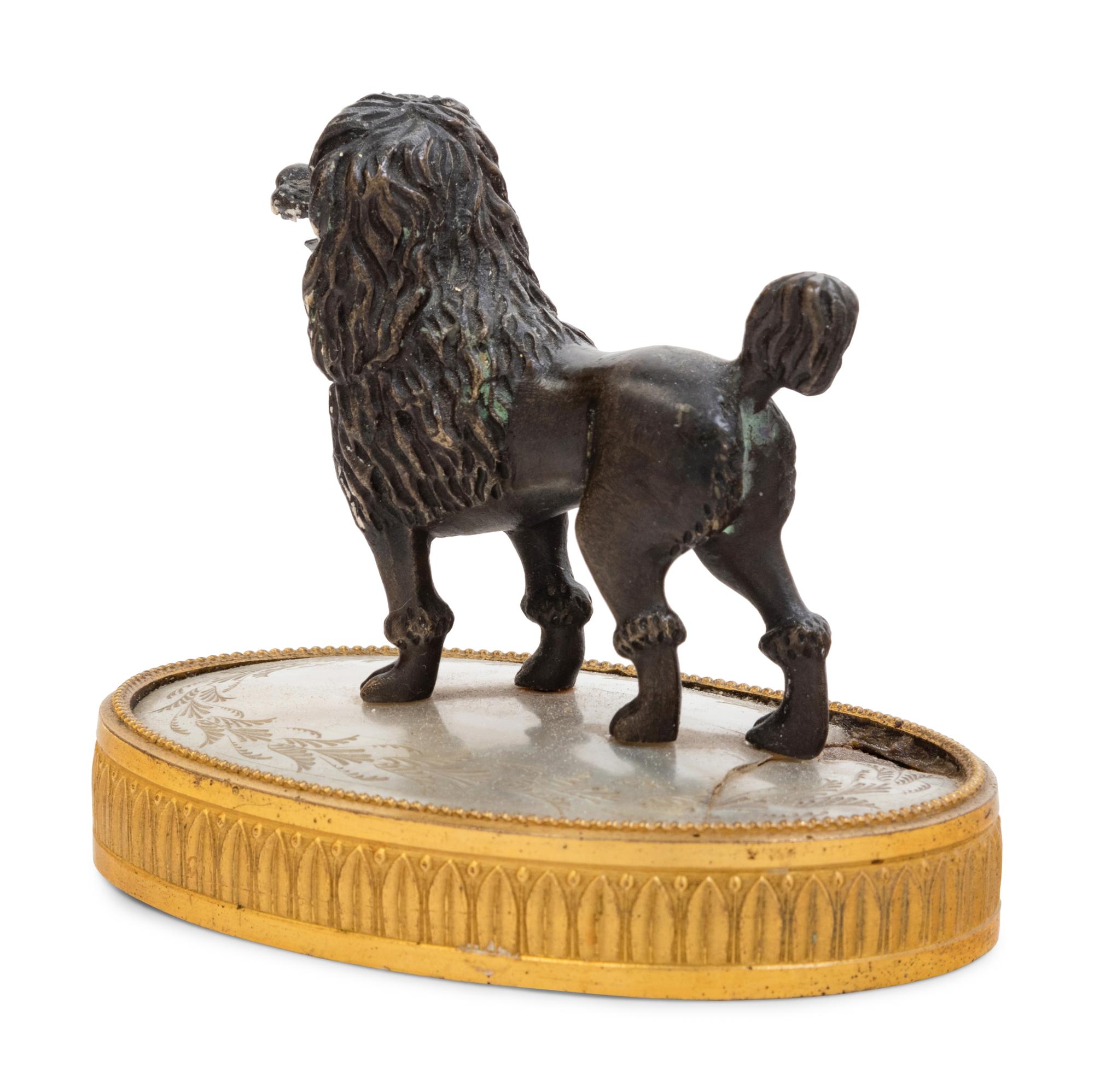 A Continental Gilt and Patinated Bronze Mother of Pearl Inset Figure of a Poodle