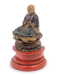 A Japanese Lacquered Wood Figure of a Seated Monk