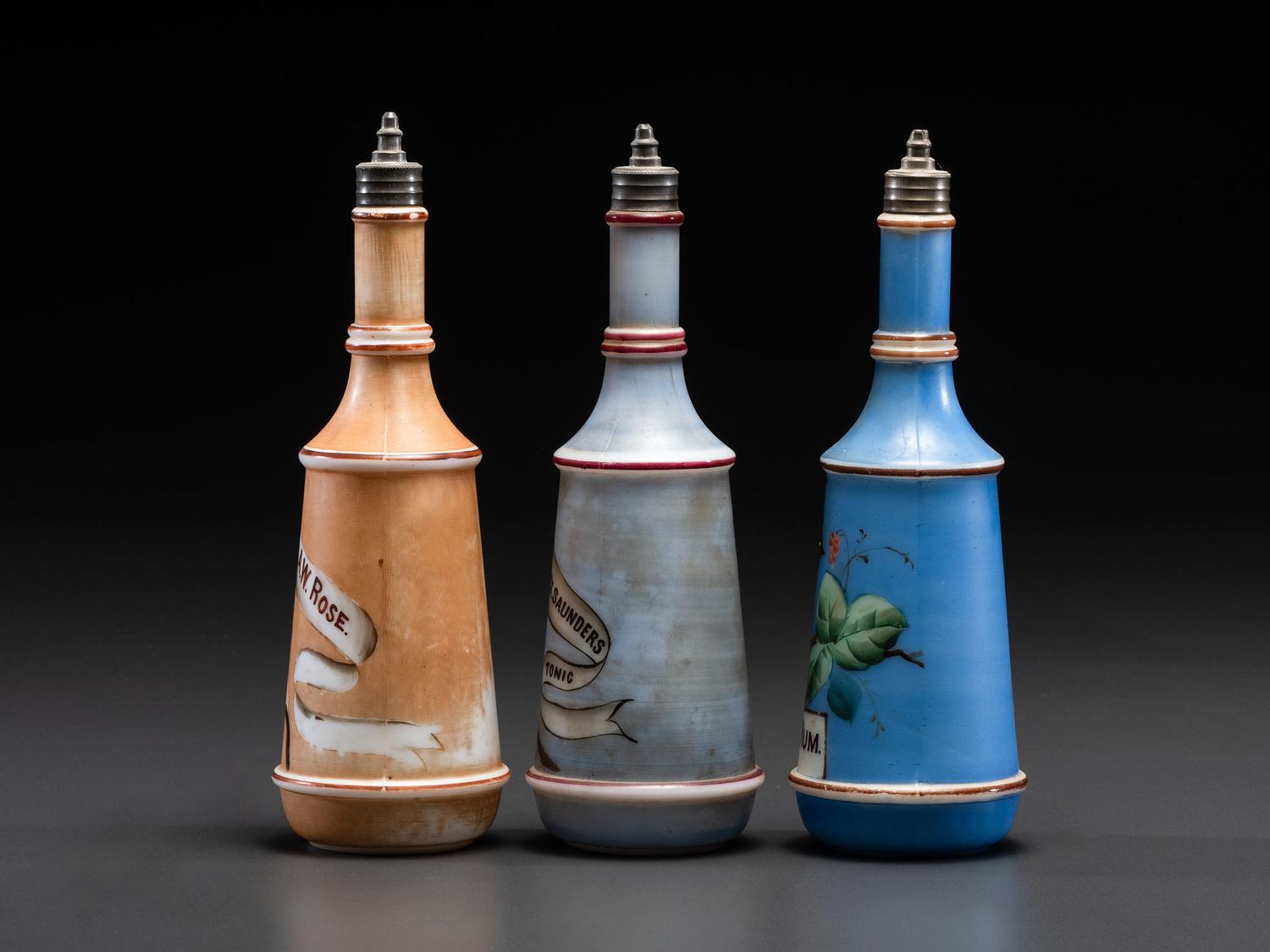 Three Paint Decorated Barber Bottles