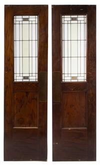 Attributed to William Eugene Drummond, (American, 1876-1948), a pair of American leaded-glass windows mounted in oak doors